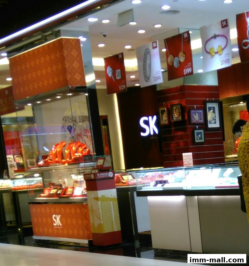 SK Jewellery shop interior with display cases showcasing jewelry and promotional posters.