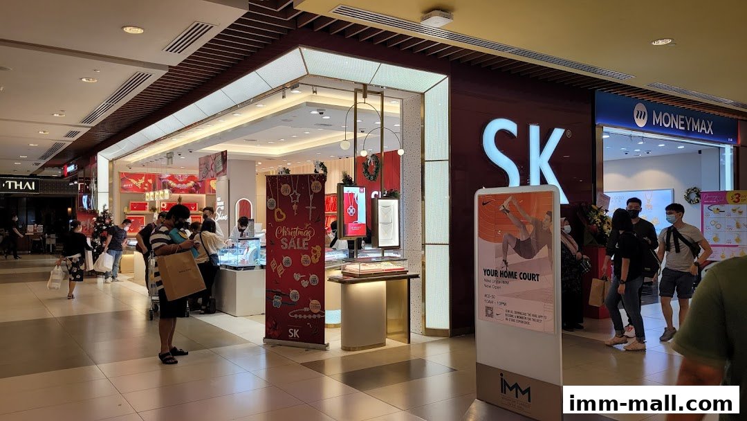 SK Jewellery store entrance with customers browsing and a Christmas sale banner.