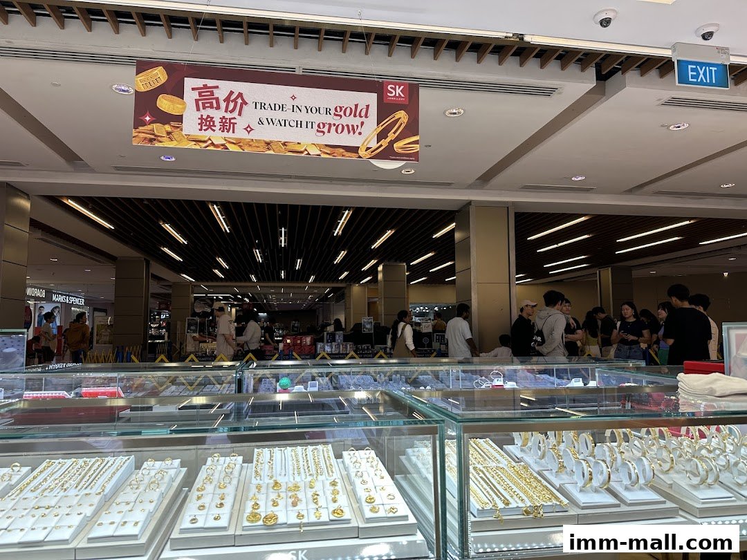 SK Jewellery shop with display cases filled with gold jewelry and a promotional banner.