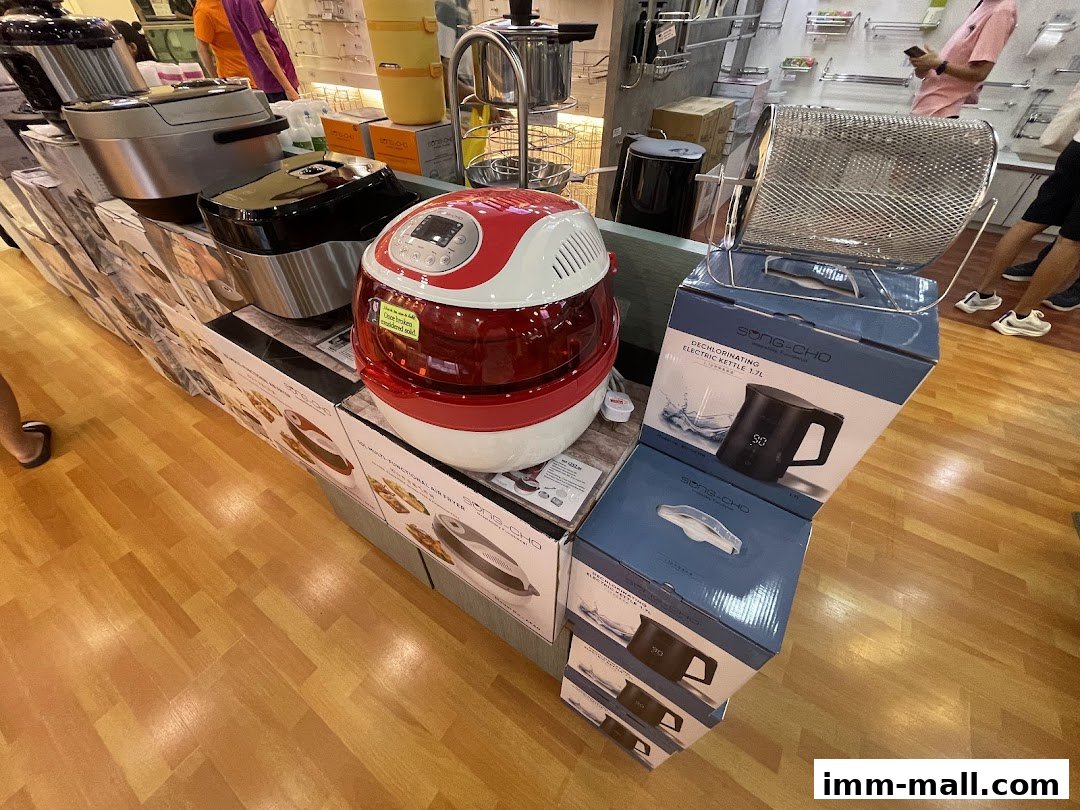 A display of kitchen appliances including air fryers and electric kettles at Song-Cho.