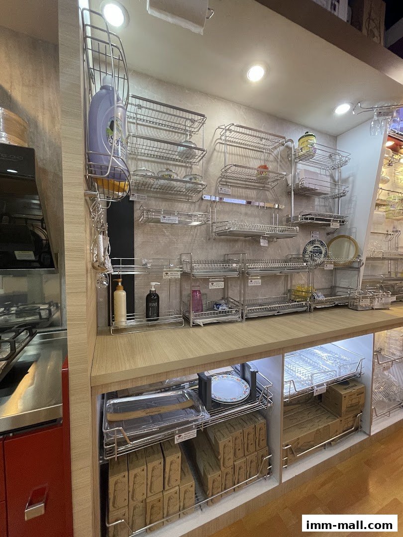 A display of various kitchen racks and storage solutions, including dish racks and organizers.