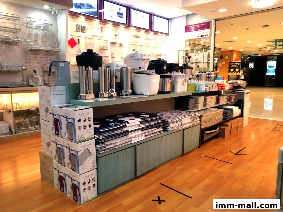 A retail display featuring kitchen appliances, cookware, and home goods.