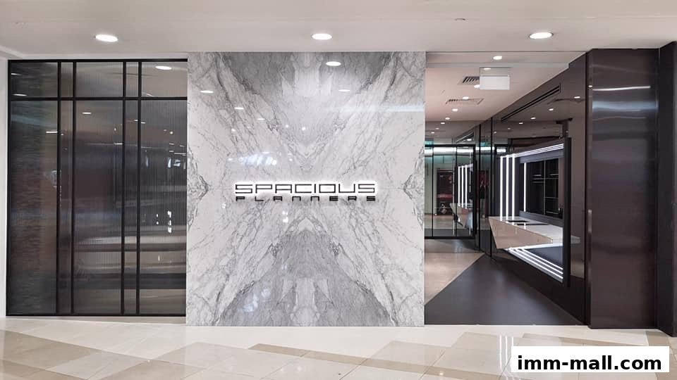 The modern storefront of Spacious Planners Pte. Ltd. with marble accents and sleek interior.