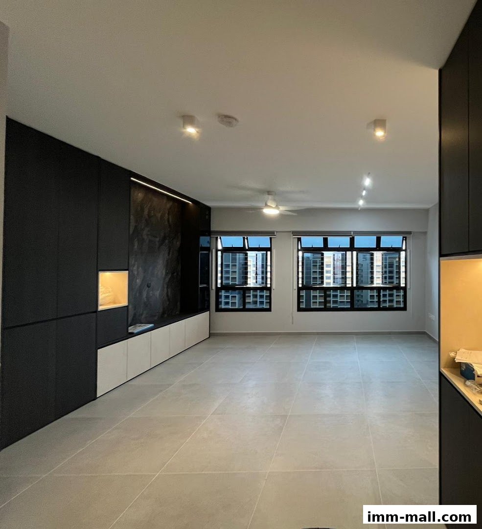 A modern living room with sleek black cabinetry, a textured accent wall, and large windows.