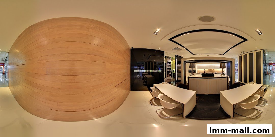 Interior view of a modern office or showroom with a large wooden curved wall and contemporary furniture.