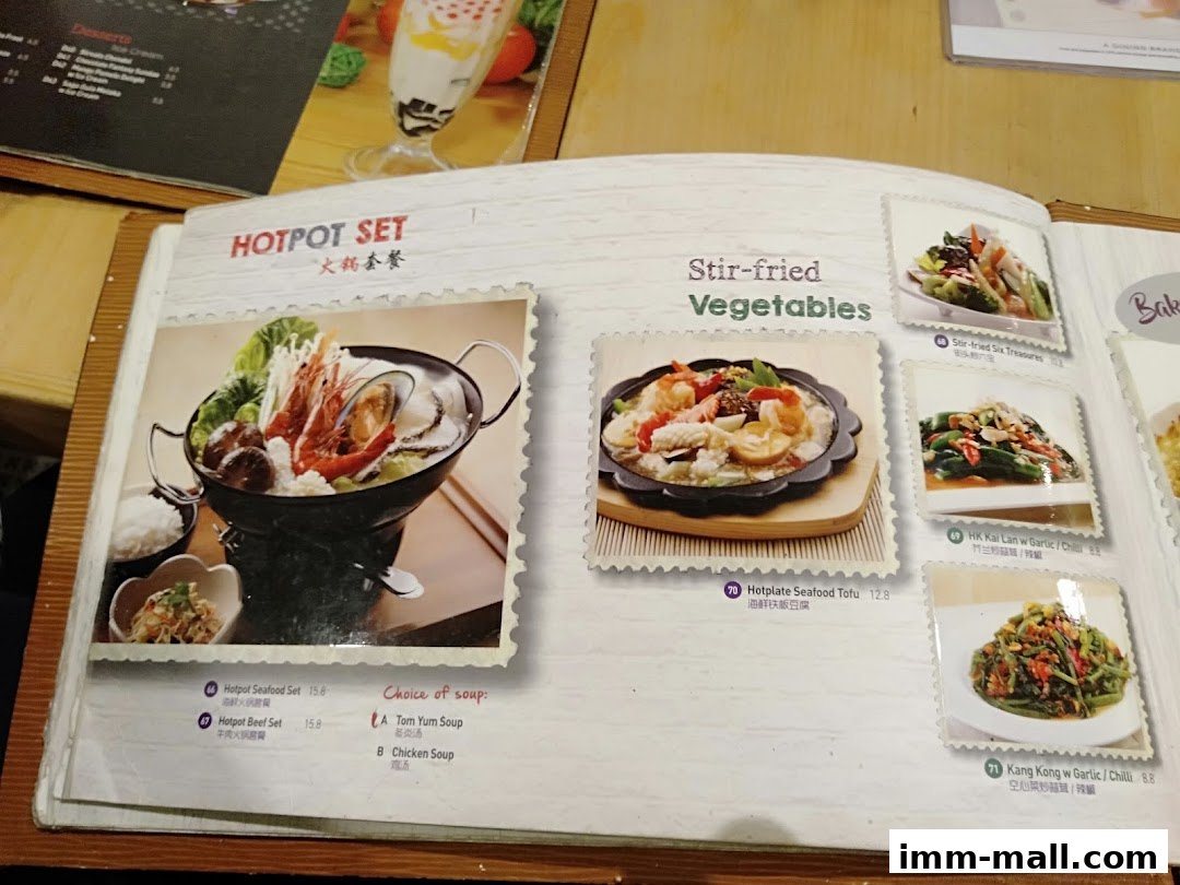 A menu page featuring hotpot sets and stir-fried vegetable dishes with images.