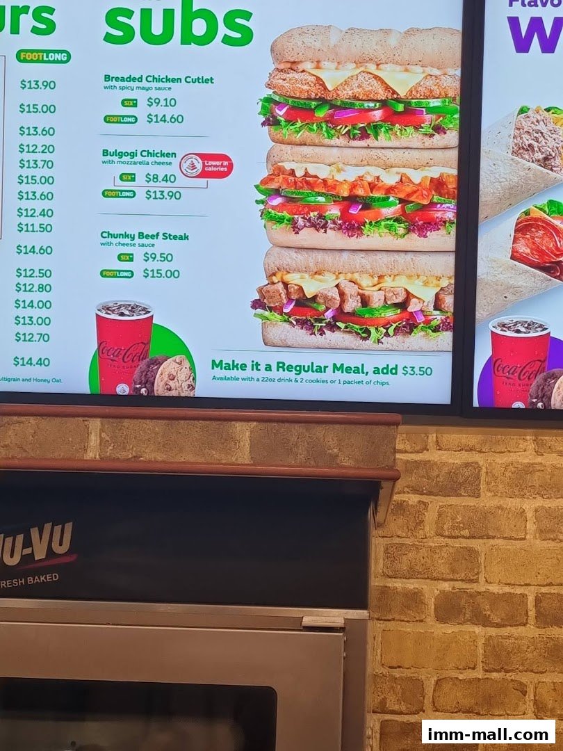 A Subway menu board displaying various subs with prices and images.