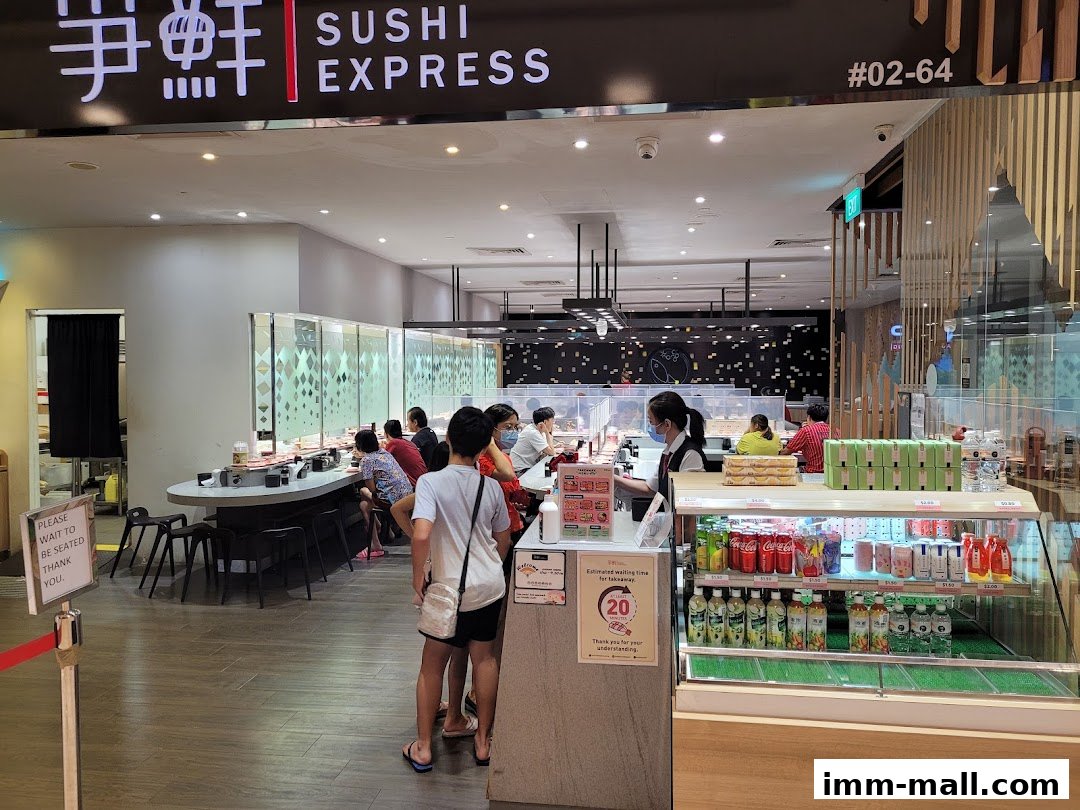 The entrance of Sushi Express with customers waiting and a display of drinks.