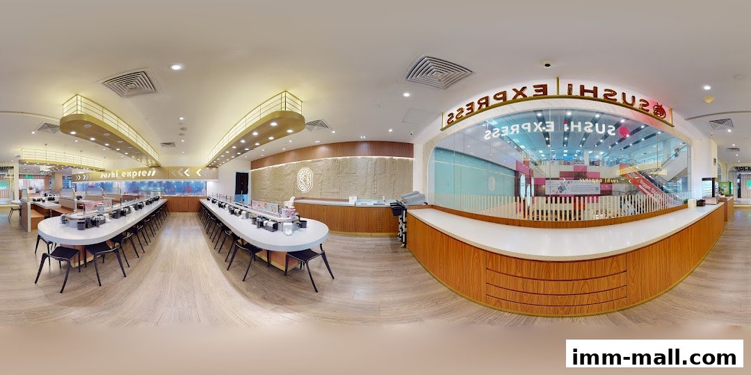 Interior view of Sushi Express with conveyor belt sushi and seating.