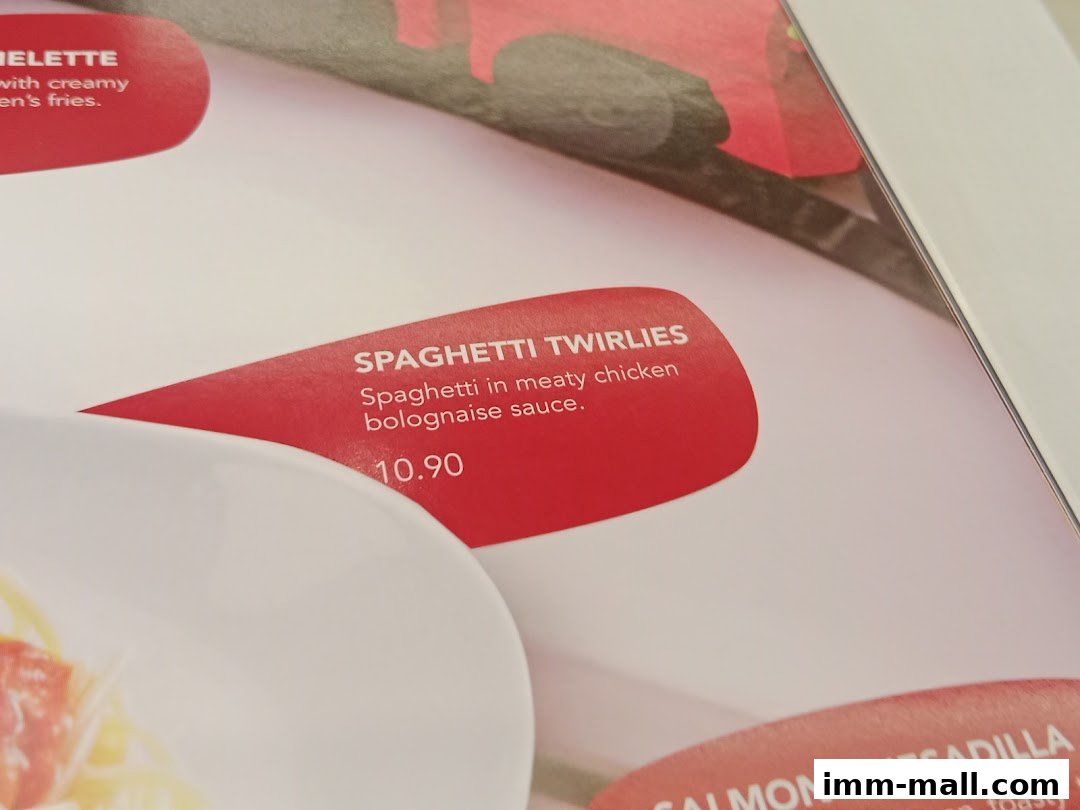 A close-up of a menu showing Spaghetti Twirlies with description and price.