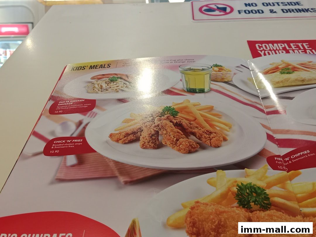 A menu featuring kids' meals with pasta, chicken strips, and fish and chips.