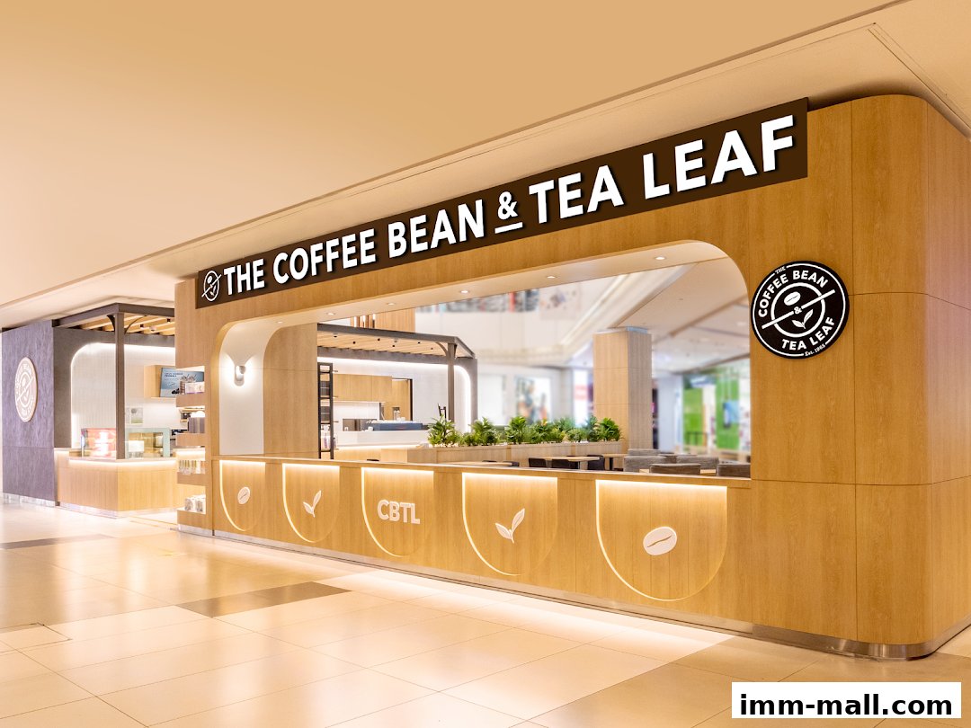 The Coffee Bean & Tea Leaf shop front with a modern wooden design and illuminated signage.