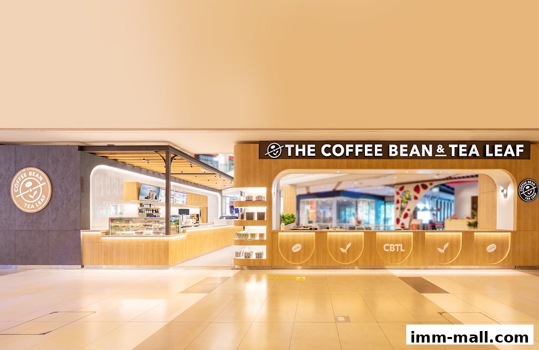 The Coffee Bean & Tea Leaf shop front with a modern wooden counter and illuminated signage.