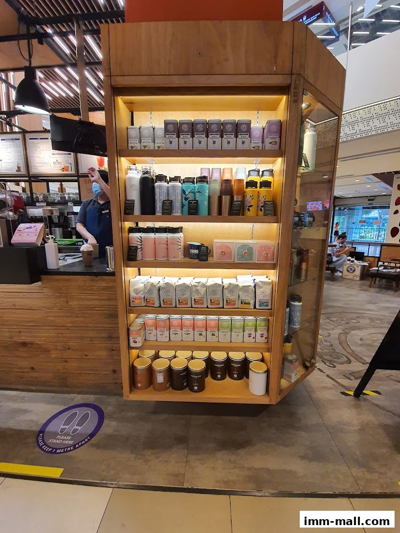 A display shelf filled with coffee and tea products at The Coffee Bean & Tea Leaf.