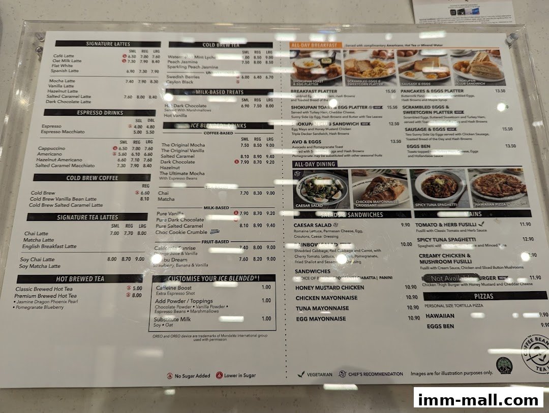 A menu board displaying various coffee, tea, breakfast, and lunch options with prices.