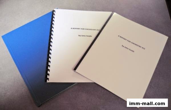 Three reports are displayed, two with titles and author names, on a textured surface.