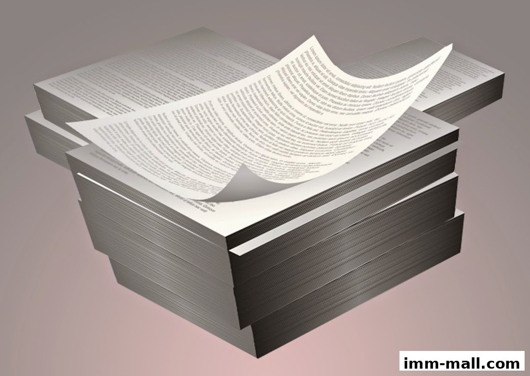 A stack of papers with text, one sheet is curled.