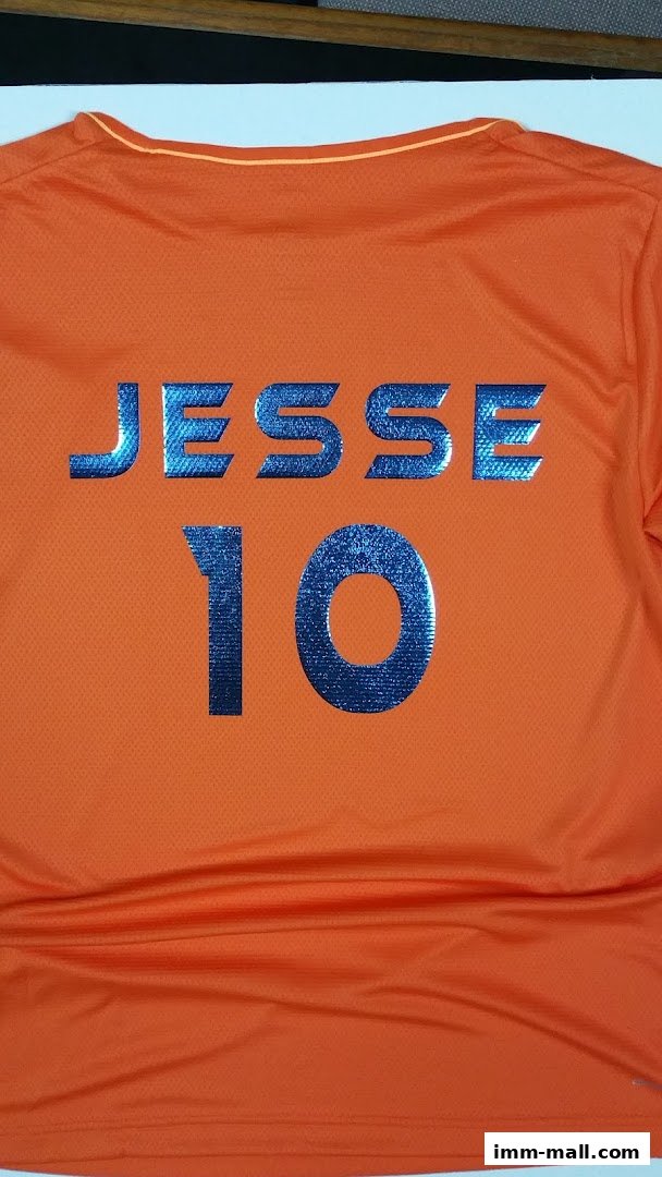 An orange t-shirt with blue metallic lettering spelling 'JESSE' and the number '10'.