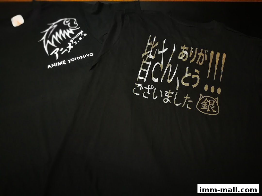 Two black t-shirts with Japanese text and graphics, one with a lion logo.