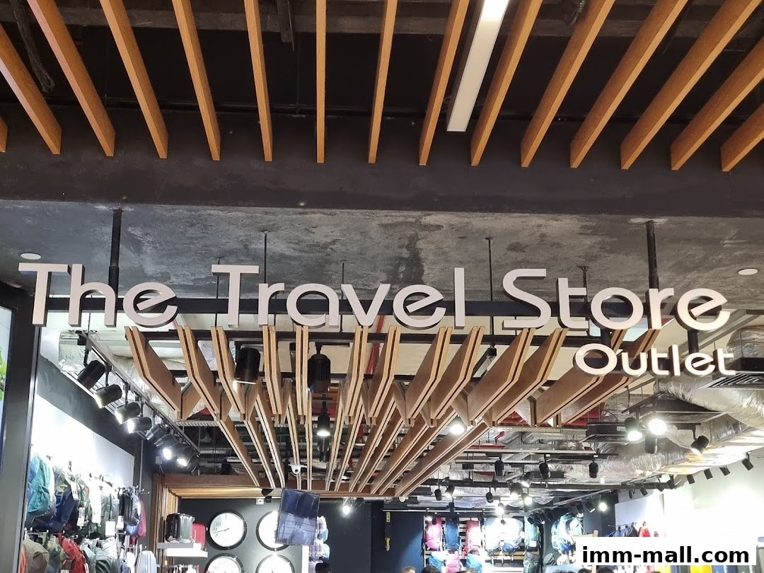 The entrance of 'The Travel Store Outlet' with various travel bags and accessories displayed.