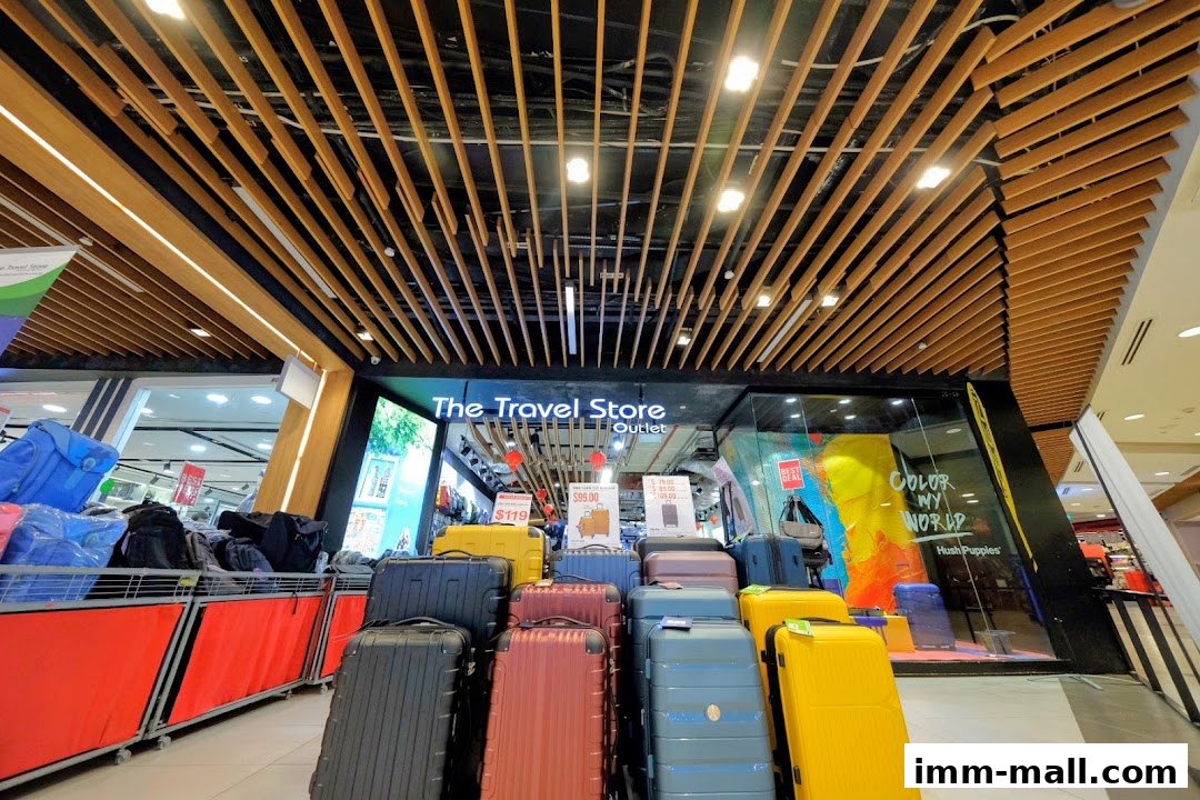 The Travel Store outlet displays a variety of colorful luggage and travel bags.