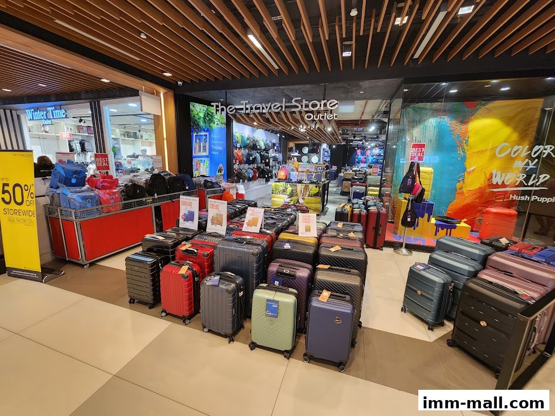 The Travel Store outlet displays a wide selection of luggage and travel bags, with a 50% off sale advertised.