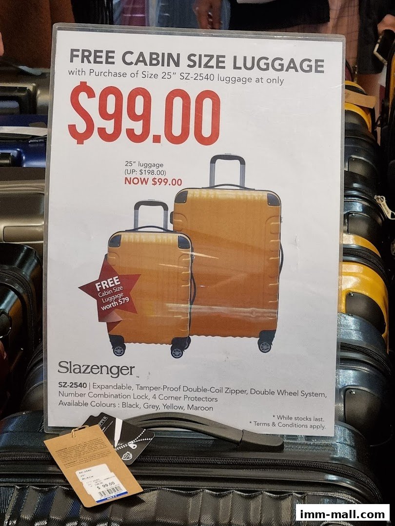A sign advertising free cabin size luggage with the purchase of 25" luggage for $99.