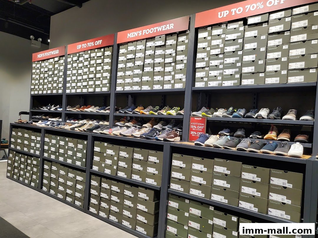 Timberland store interior showcasing shelves of men's footwear boxes and shoes on display.
