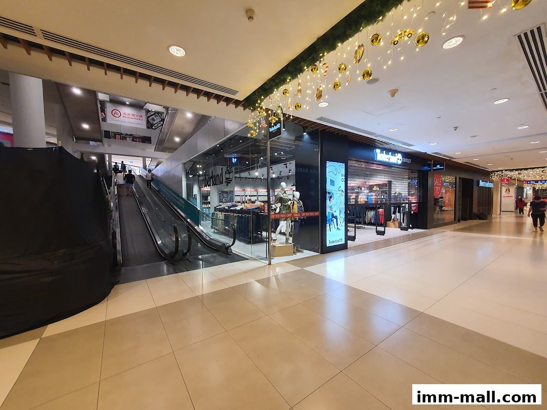 The Timberland store entrance with mannequins and clothing displays inside.