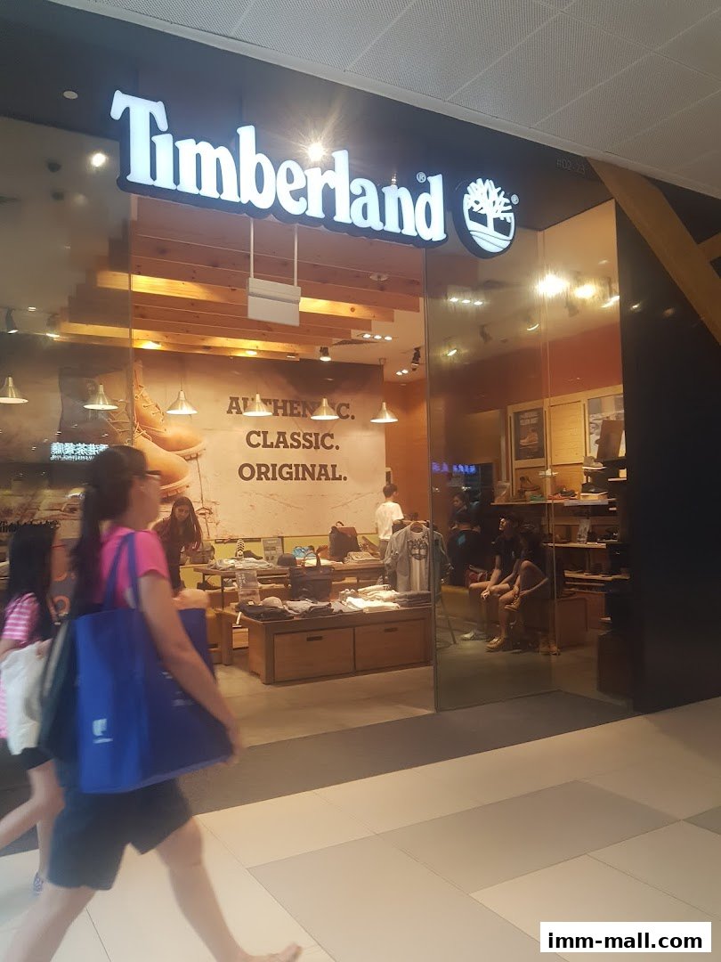 The Timberland store entrance with its iconic logo and display of boots and apparel.