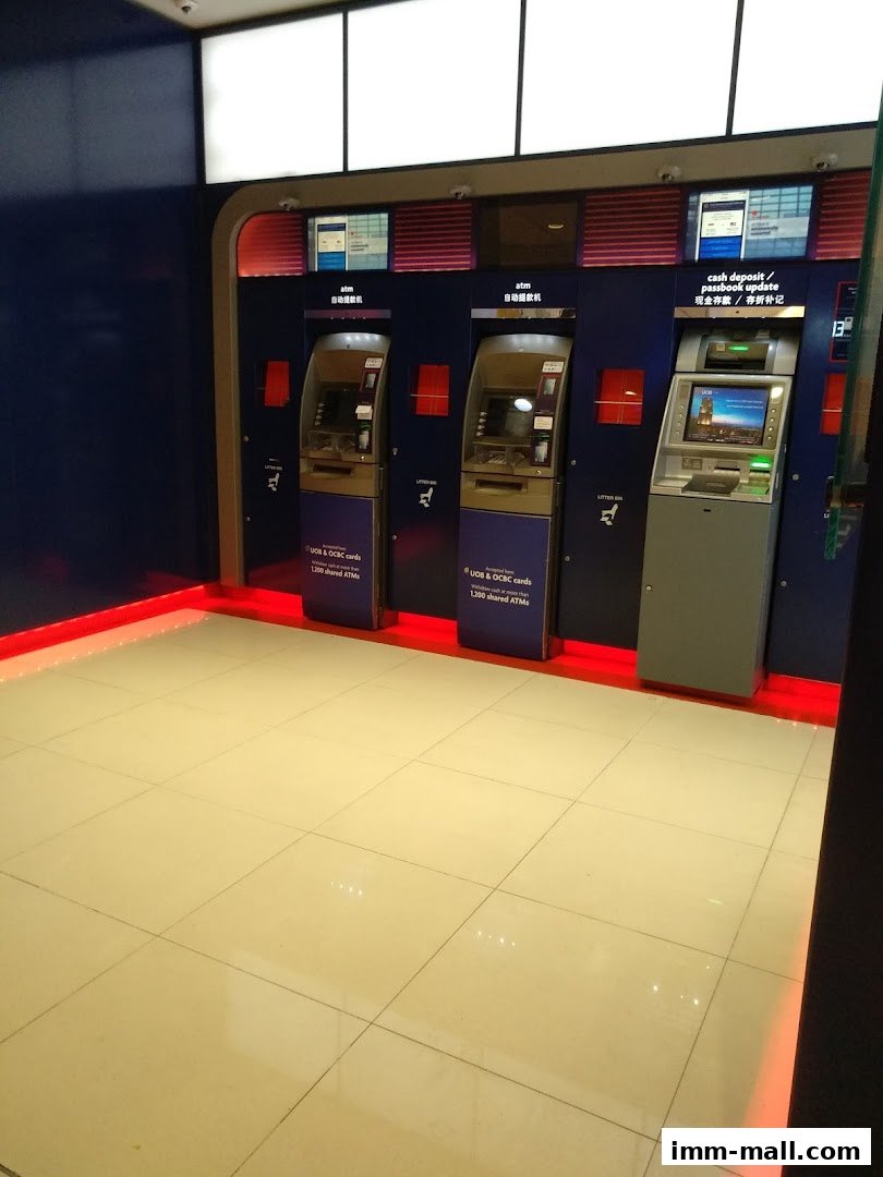 Three ATMs are lined up, with one offering cash deposit and passbook update services.