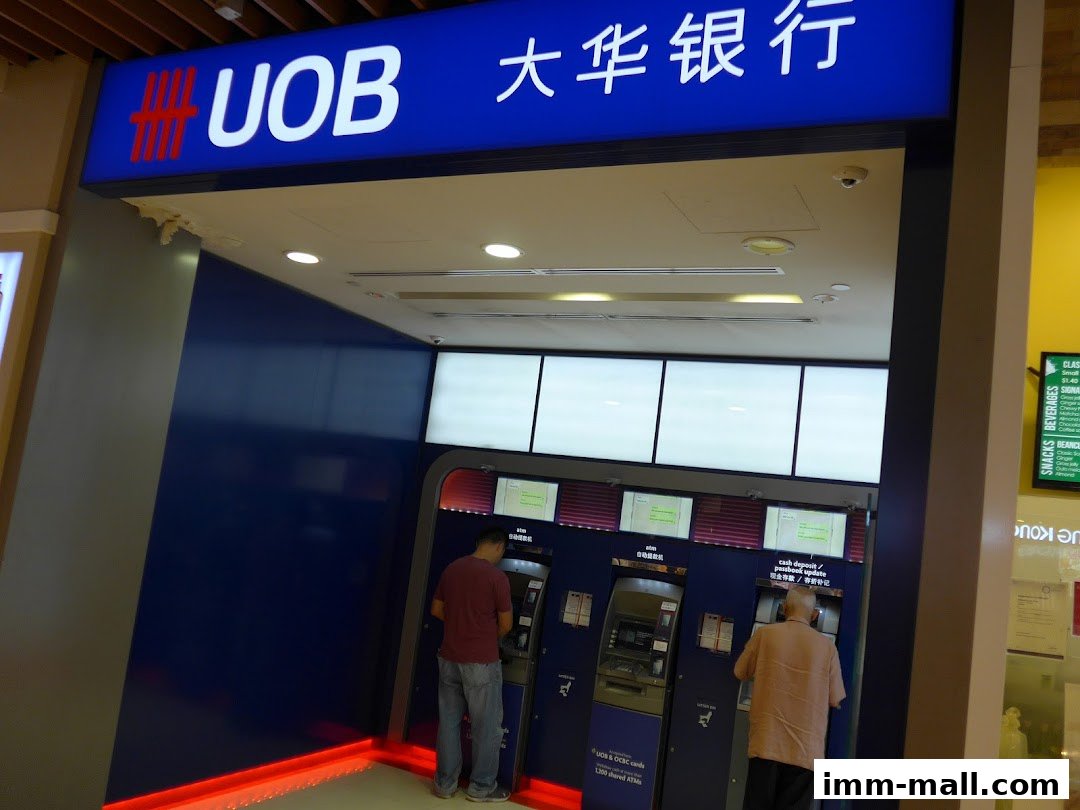 A UOB ATM area with two people using the machines.