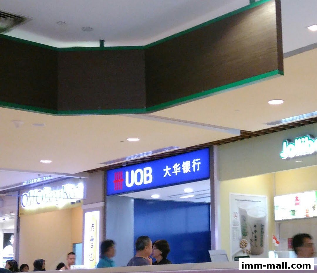 A UOB bank branch and a Jollibee restaurant are visible in a shopping mall.