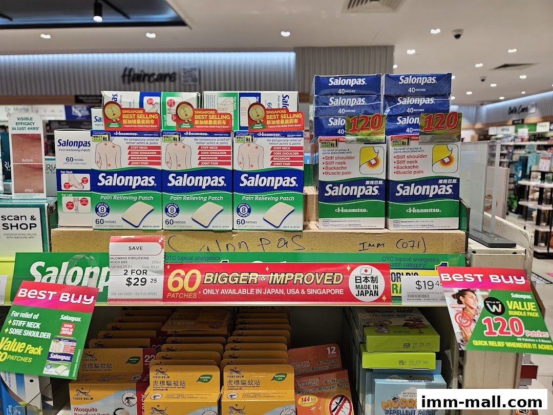A display of Salonpas pain relief patches and other health products in a Watsons store.