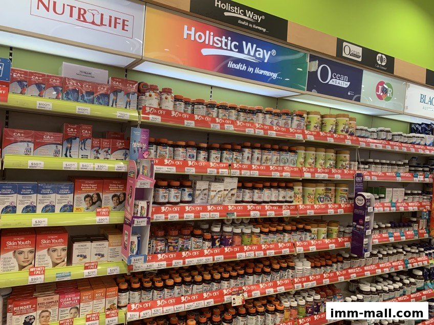 Shelves stocked with various health supplements and vitamins, many with '30% OFF' signs.