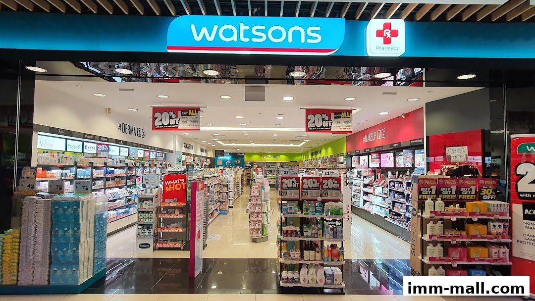 The entrance of a Watsons pharmacy and beauty store, showcasing various health and beauty products and promotions.
