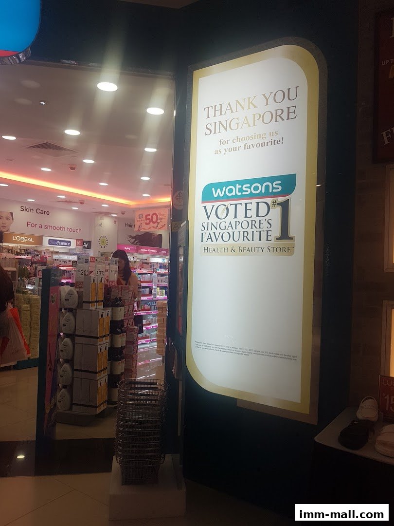 The entrance to a Watsons Health & Beauty Store with a large sign announcing it as Singapore's favourite.