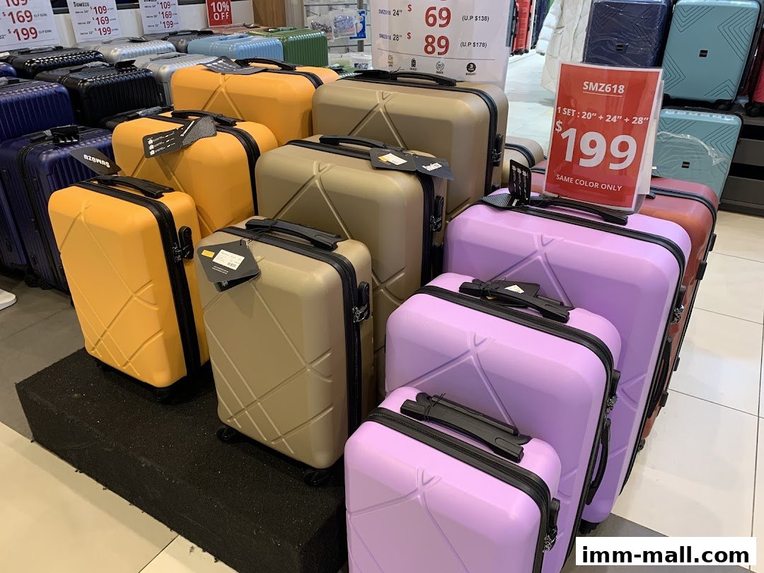 A display of colorful luggage sets in various sizes and colors.