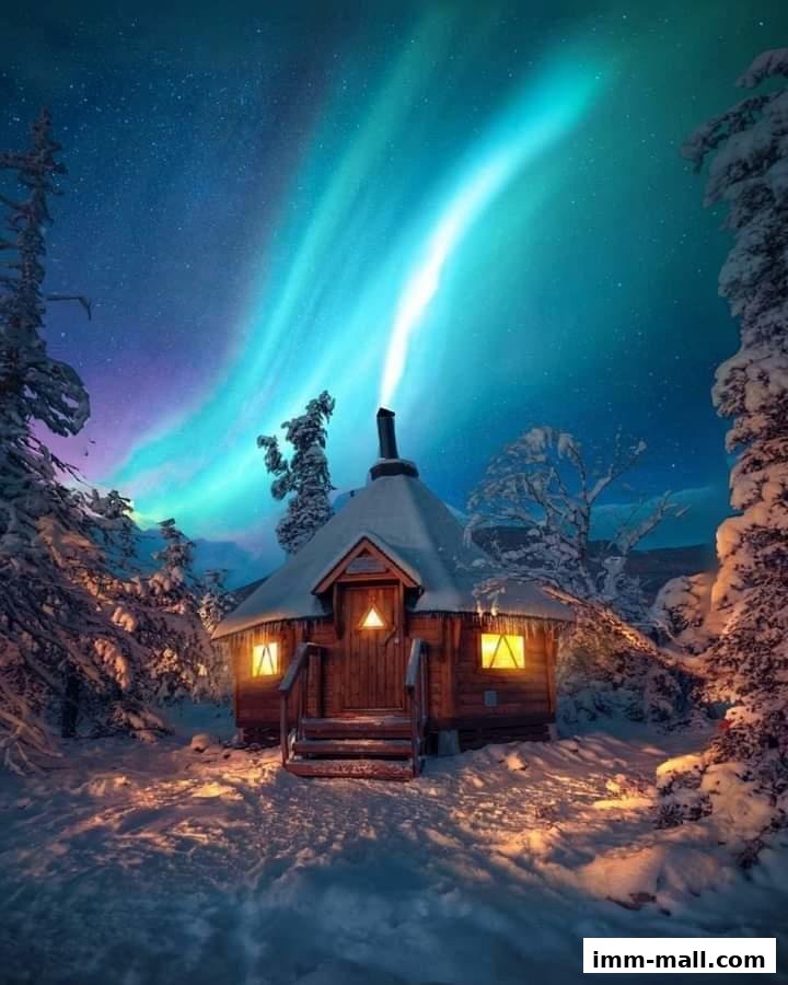 A cozy wooden cabin nestled in a snowy forest under the vibrant Northern Lights.