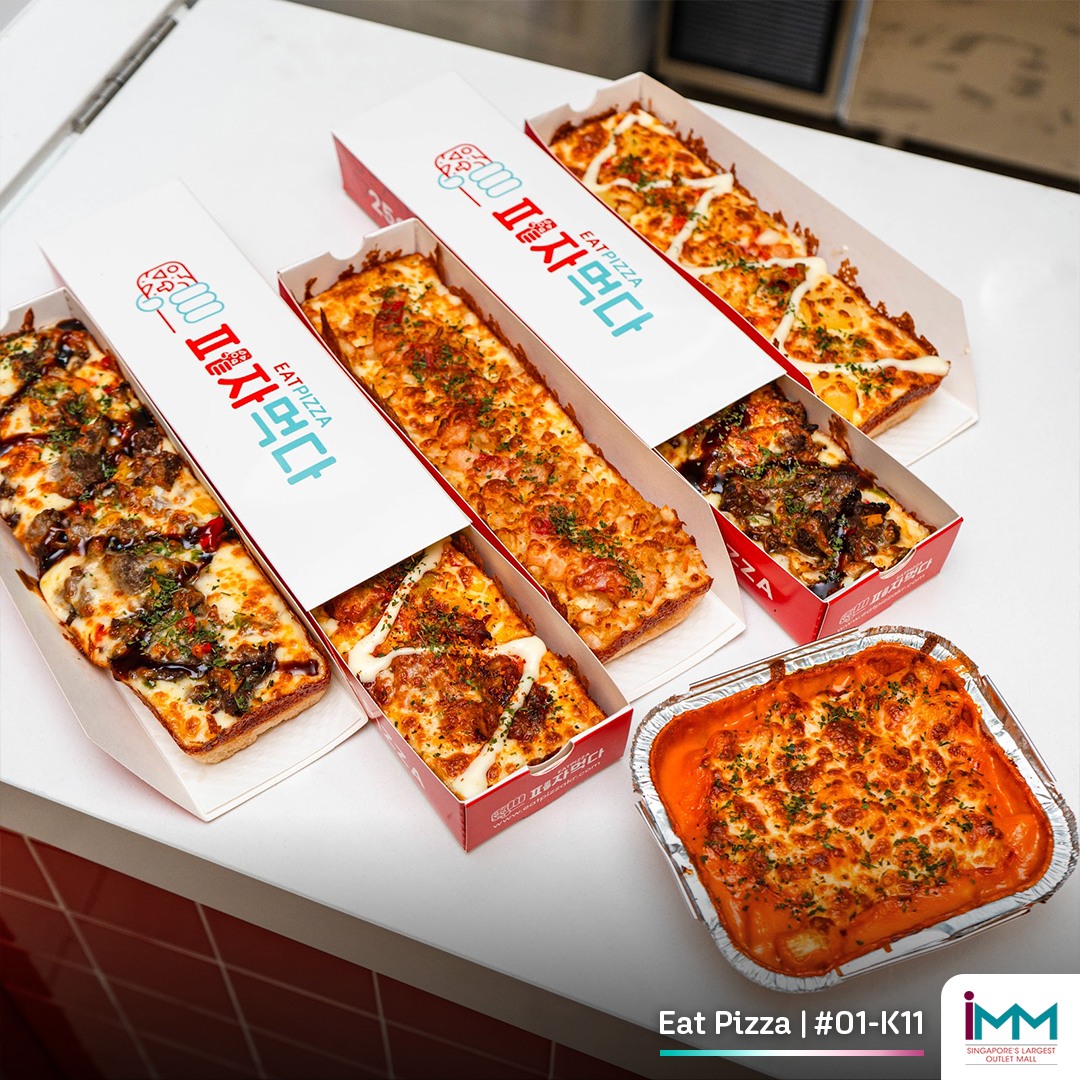 A tempting view of a hearty pizza from Eat Pizza Singapore, ready to be enjoyed