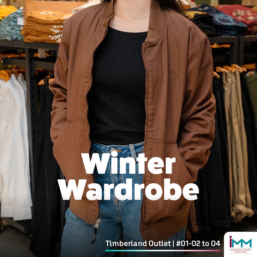 An individual confidently navigating snowy terrain in Timberland apparel.